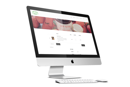 iMac computer displaying Ecommerce website shopping cart page